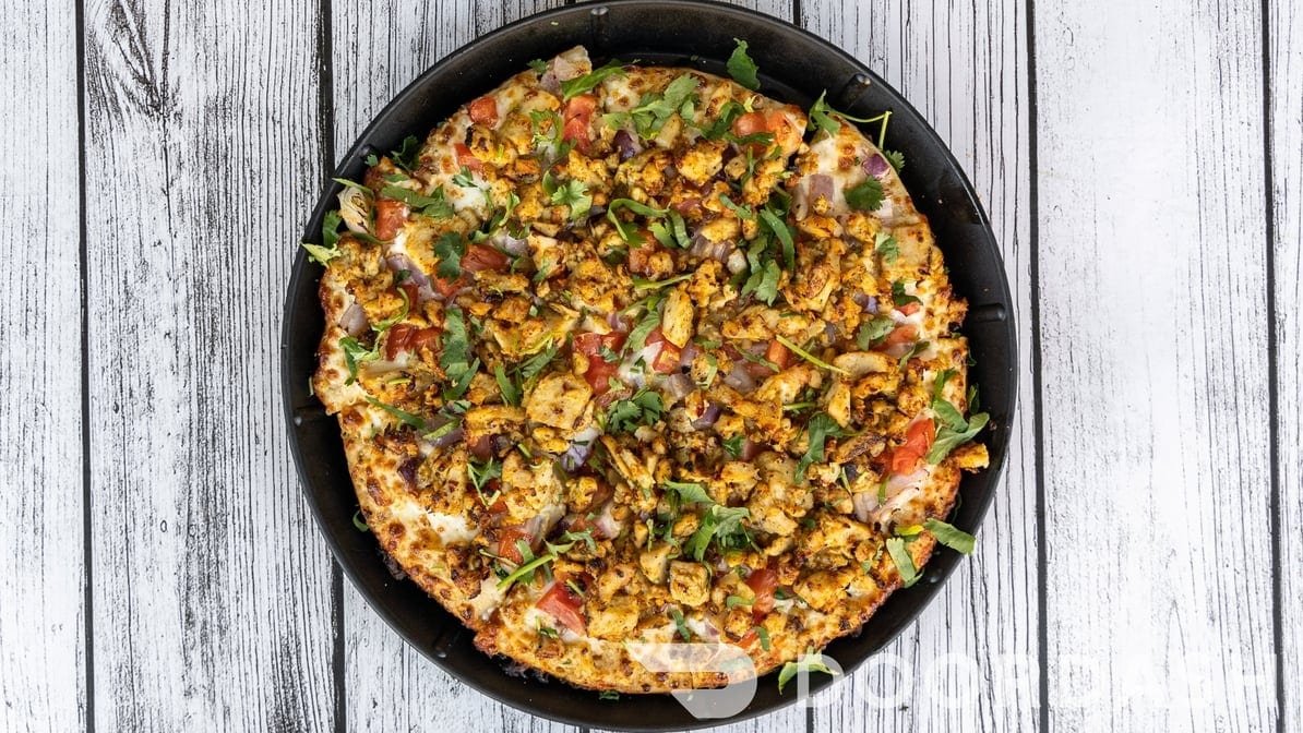 East Meets West Pizza (Chicken Tikka with Pepperoni).
