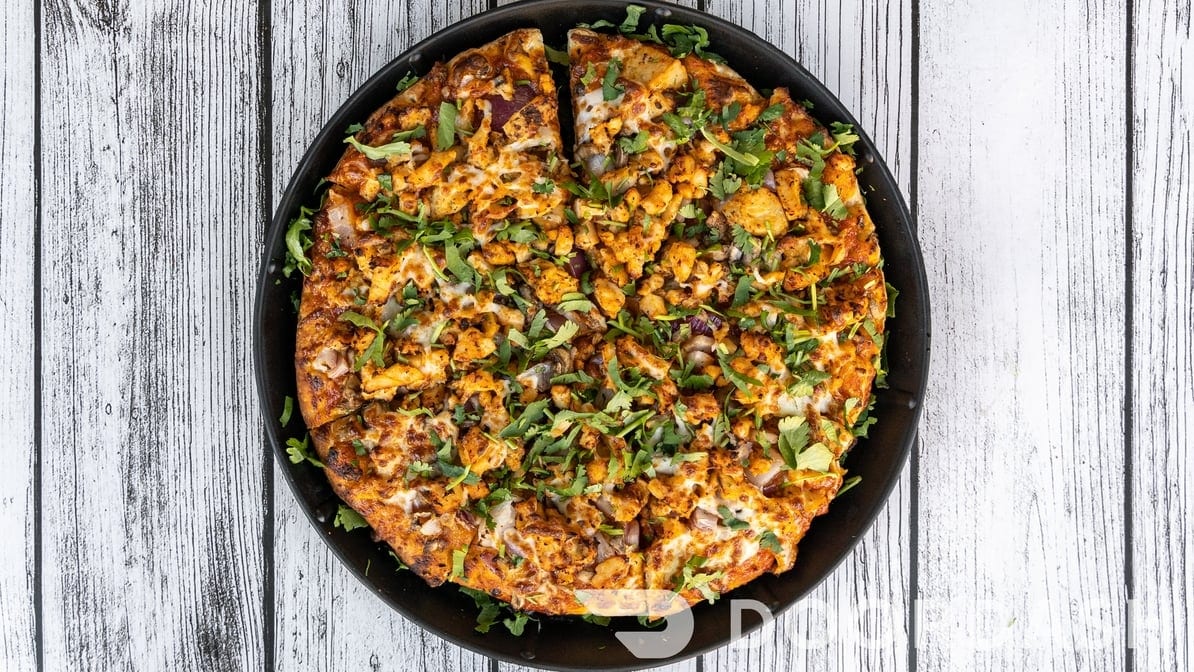 East Meets West Pizza (Chicken Tikka with Pepperoni).